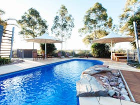 Majestic Oasis Apartments Pool and Barbeque Area for guests