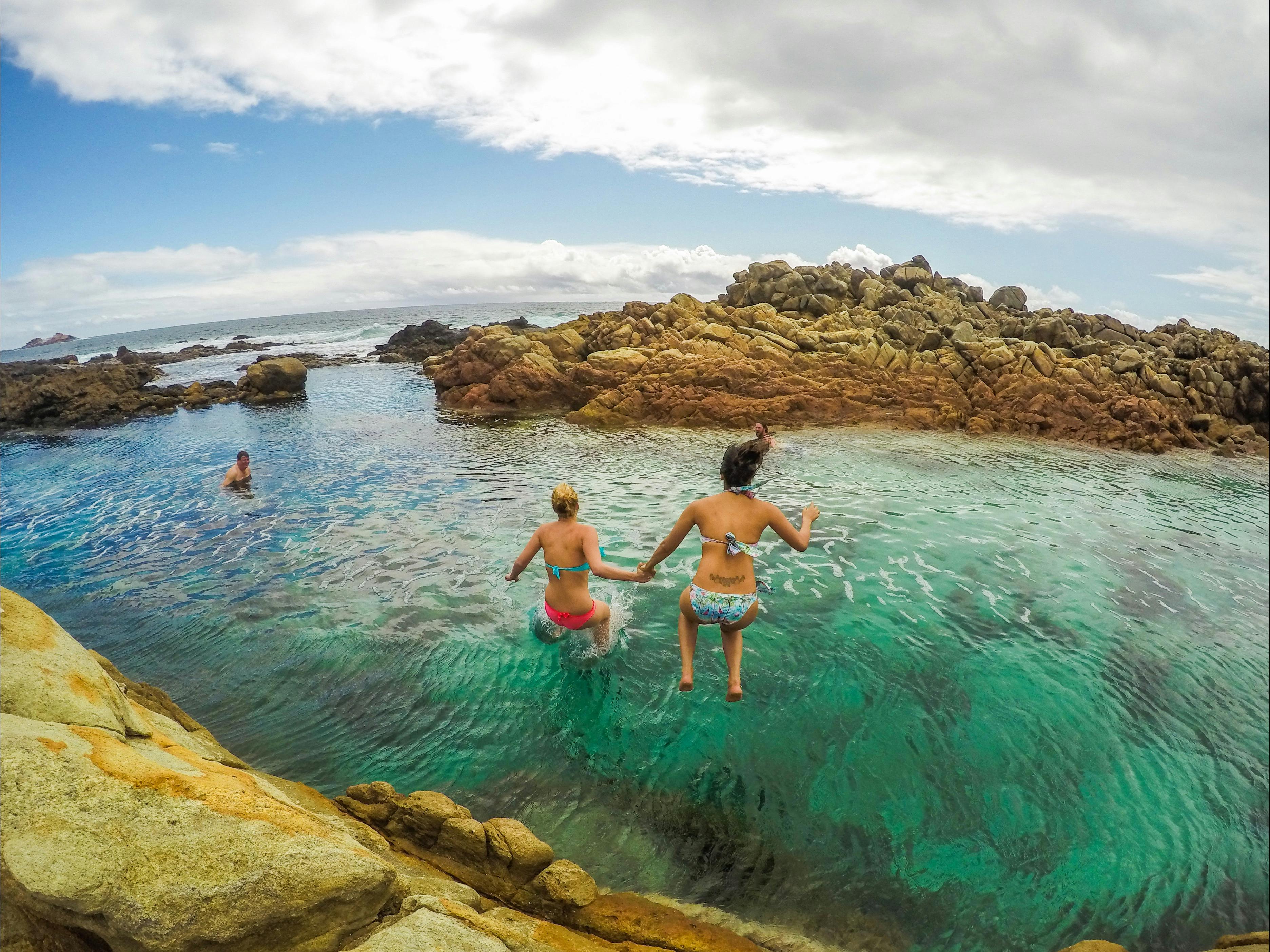 Checking out a secluded swimming hole along the Cape to Cape Track