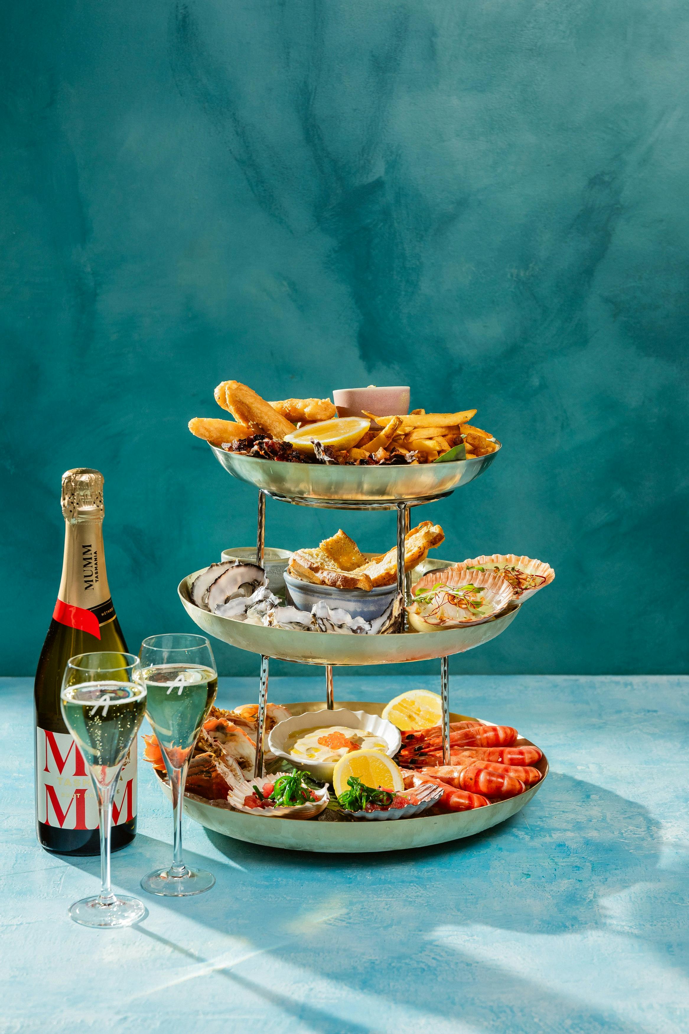A three-tier seafood platter featuring local fresh seafood.
