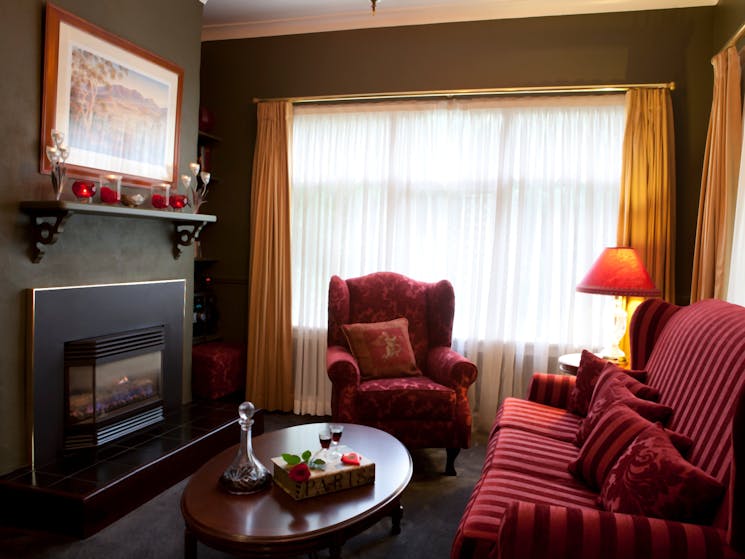 Plush lounge room complete with gas-log fireplace and complimentary port