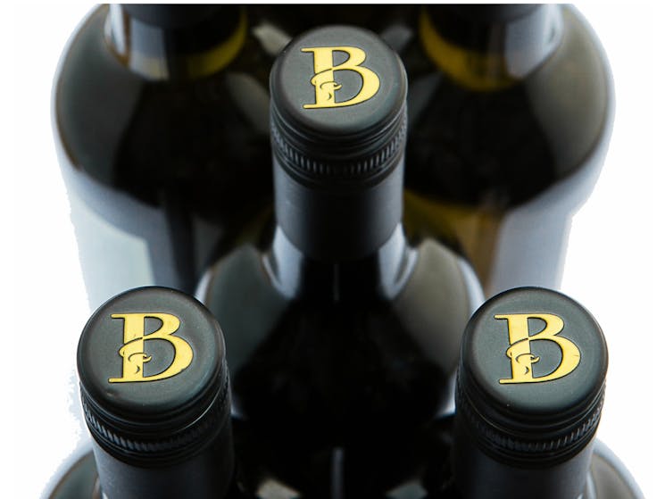 3 Brangayne wine bottles with the decorative gold B embossed on the caps.
