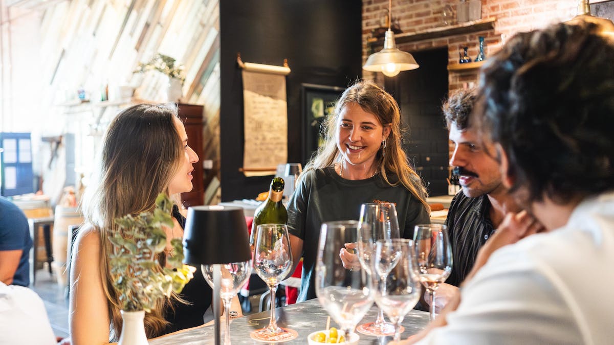 A staff member talking through a wine tasting