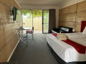 Inside room looking to shaded deck area