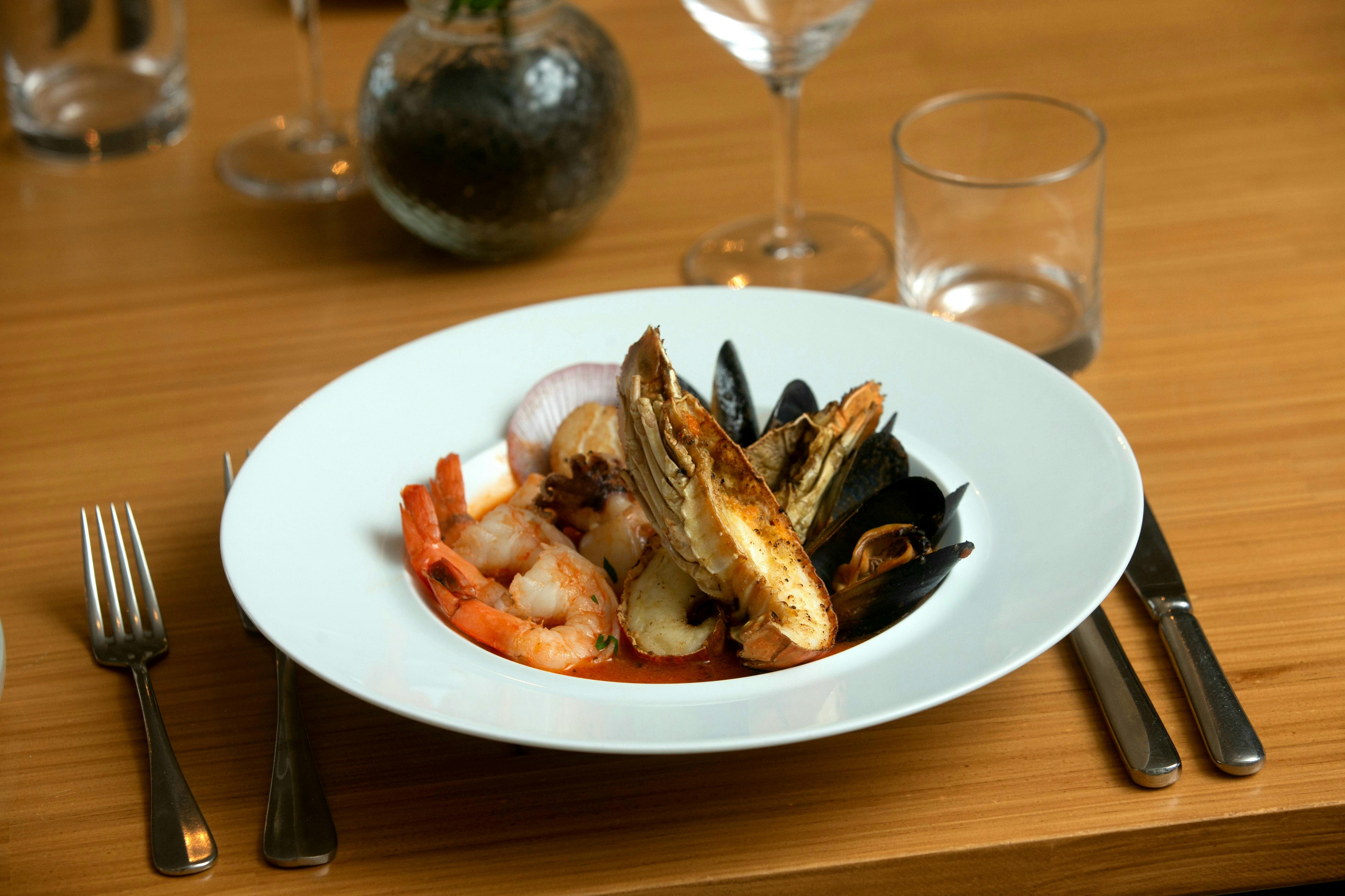 Slipper Lobster, Prawns, Mussels, Scallop, Calamari Cooked in Tomato chili Kombu Sauce and Bread