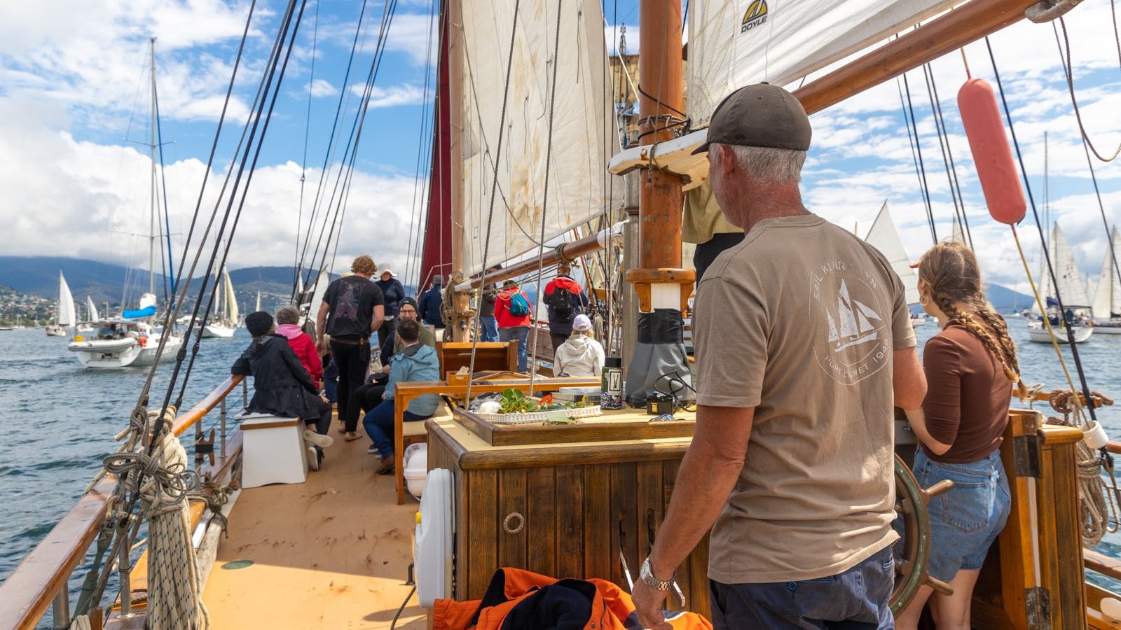 Dave at the helm during the pareade of sail for the Australian Wooden Boat Festival Hobart 2023