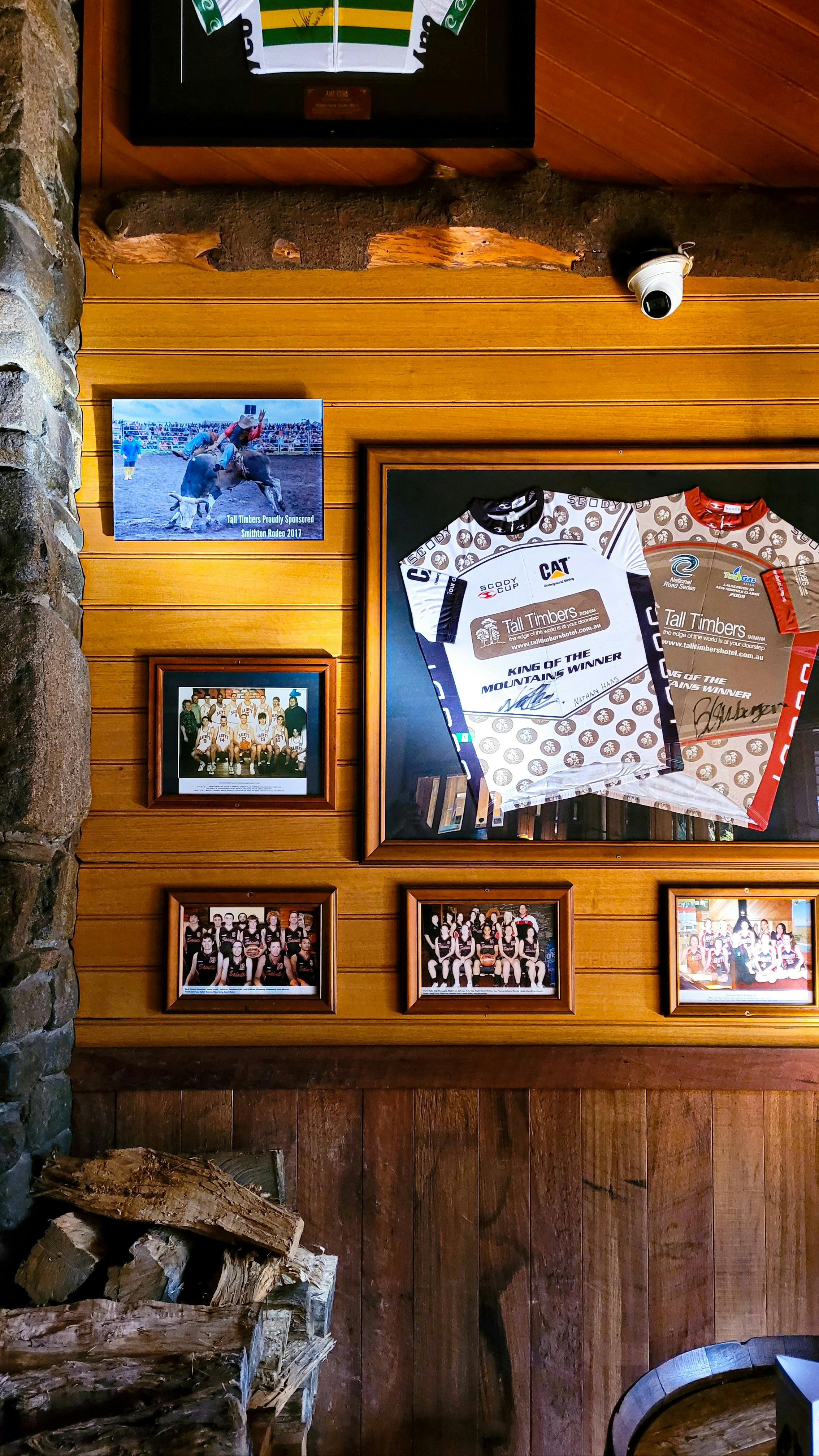 Smithton Rodeo & framed Smithton Saints Basketball photos displayed with signed cycling jerseys
