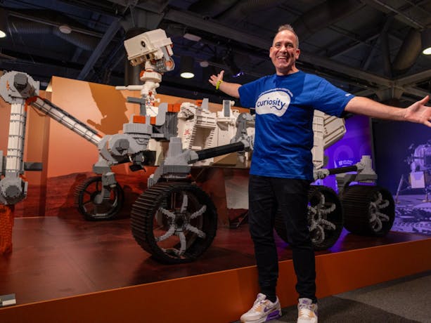 Ryan 'Brickman' McNaught with the Mars Rover Perseverence  made from LEGO® bricks