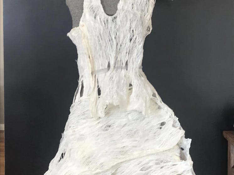 A white draped evening dress