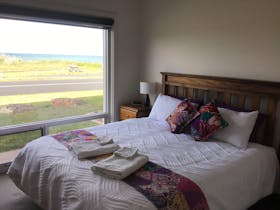 Bedroom 1 has a king bed, TV and built in robes