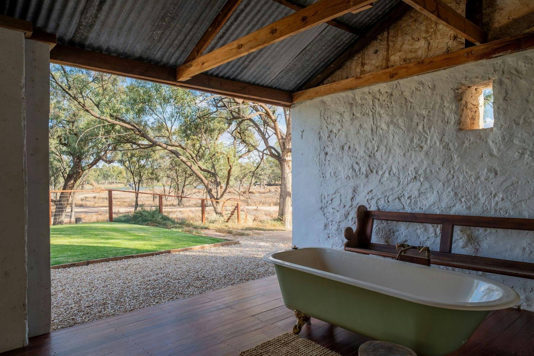 A bathtub with an amazing river view