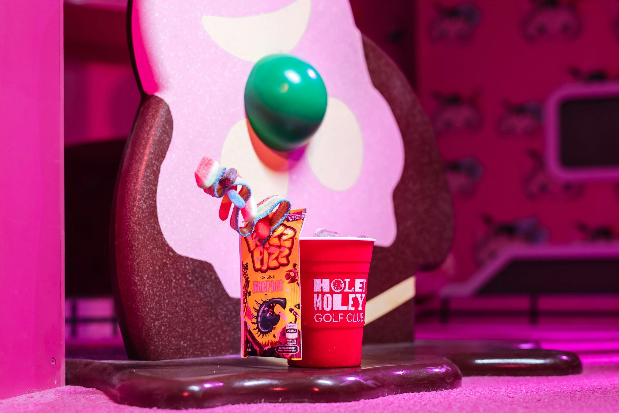 Grab your favourite cocktail at Holey Moley Chermside