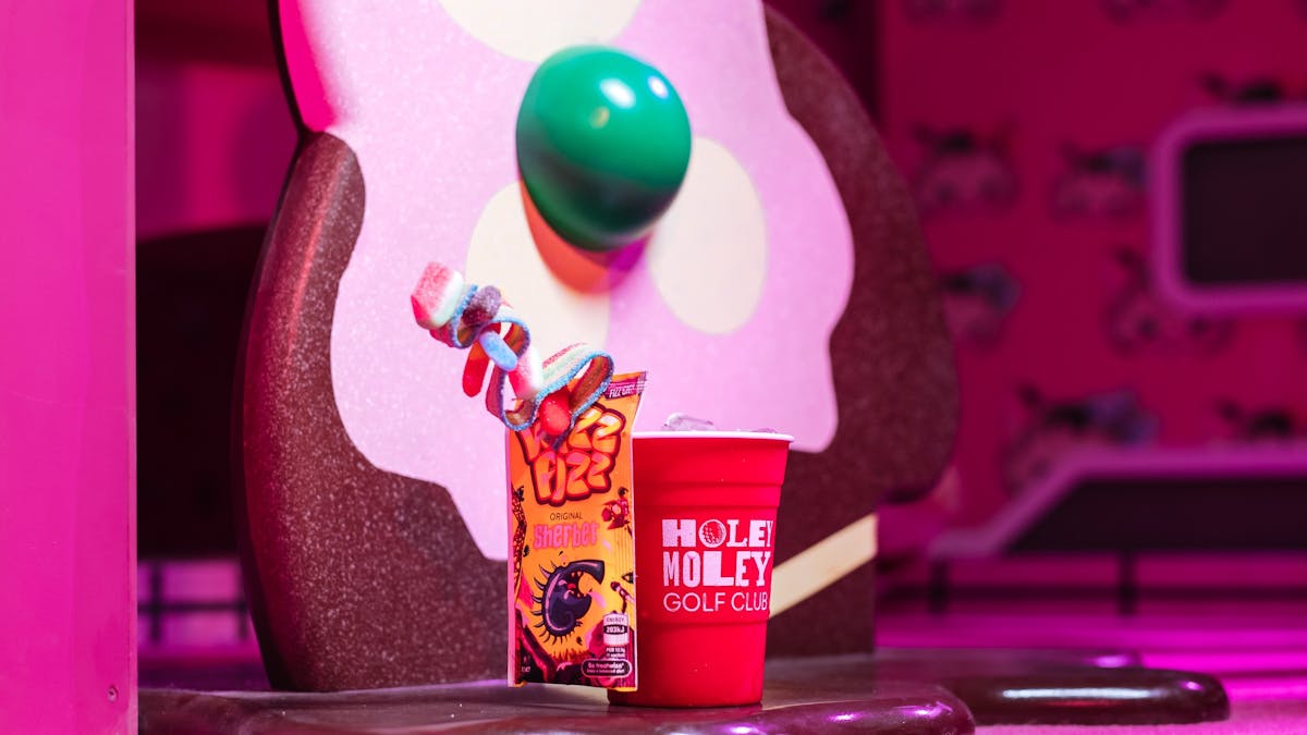 Grab your favourite cocktail at Holey Moley Chermside