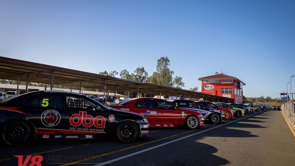 Experience cars lined up in pitlane
