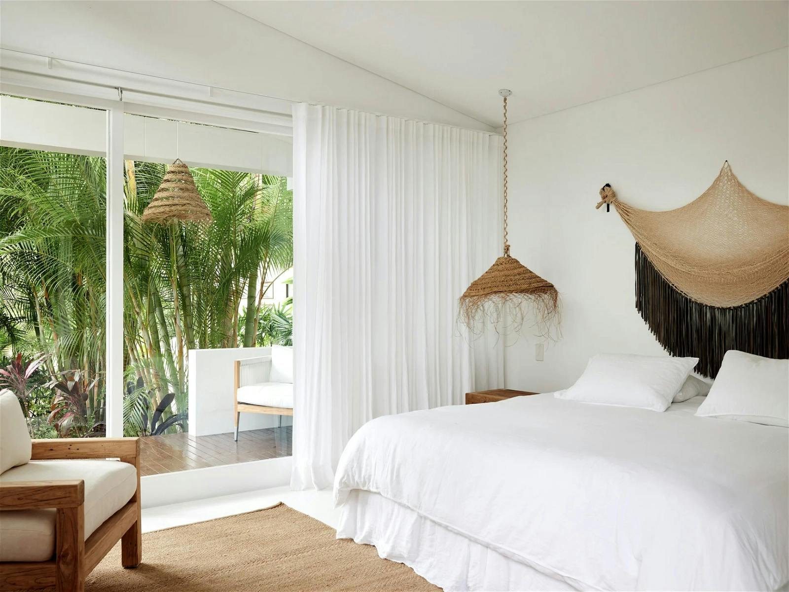 Cozy bedroom with warm lighting and a comfortable king-size bed