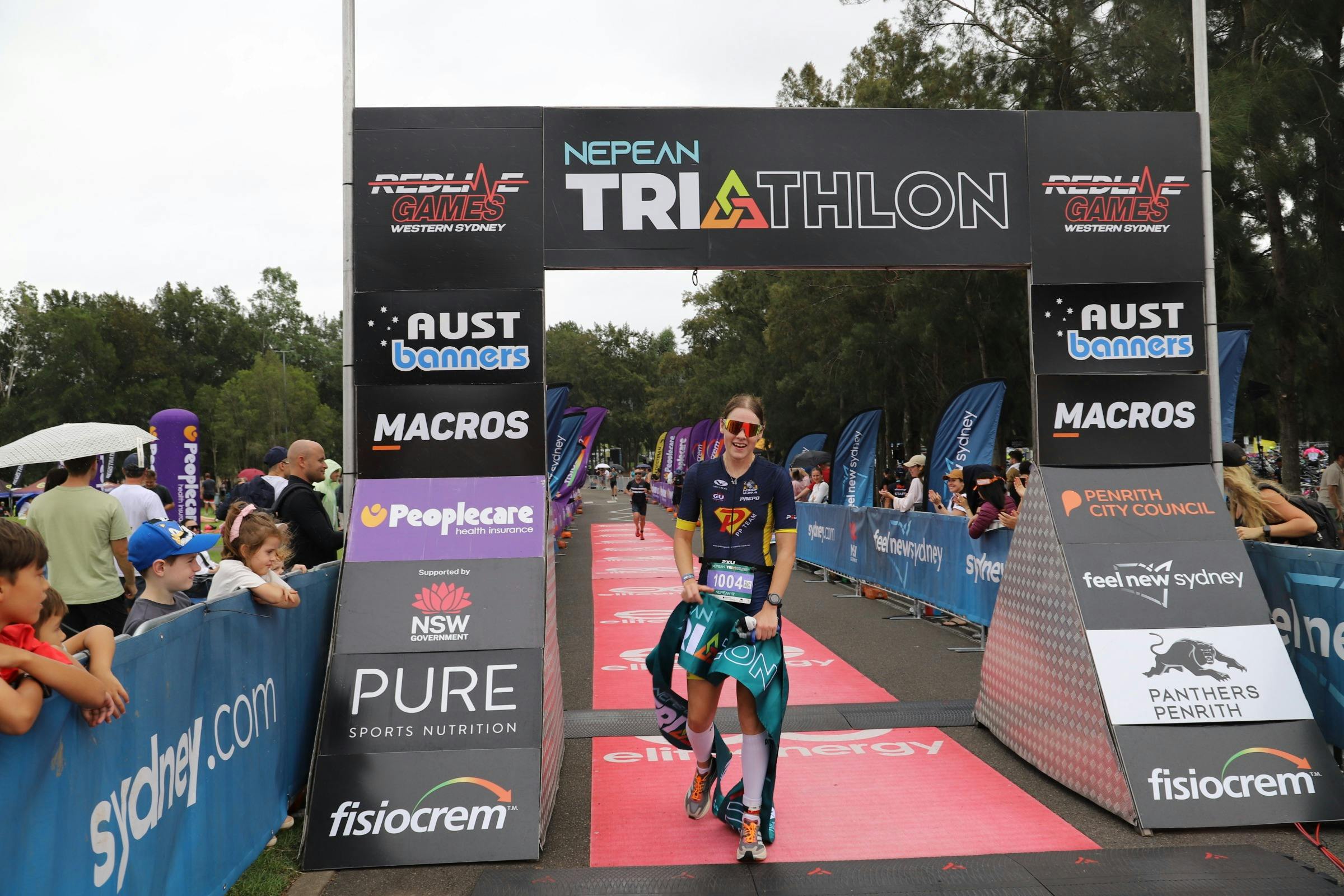 athlete crossing finish line