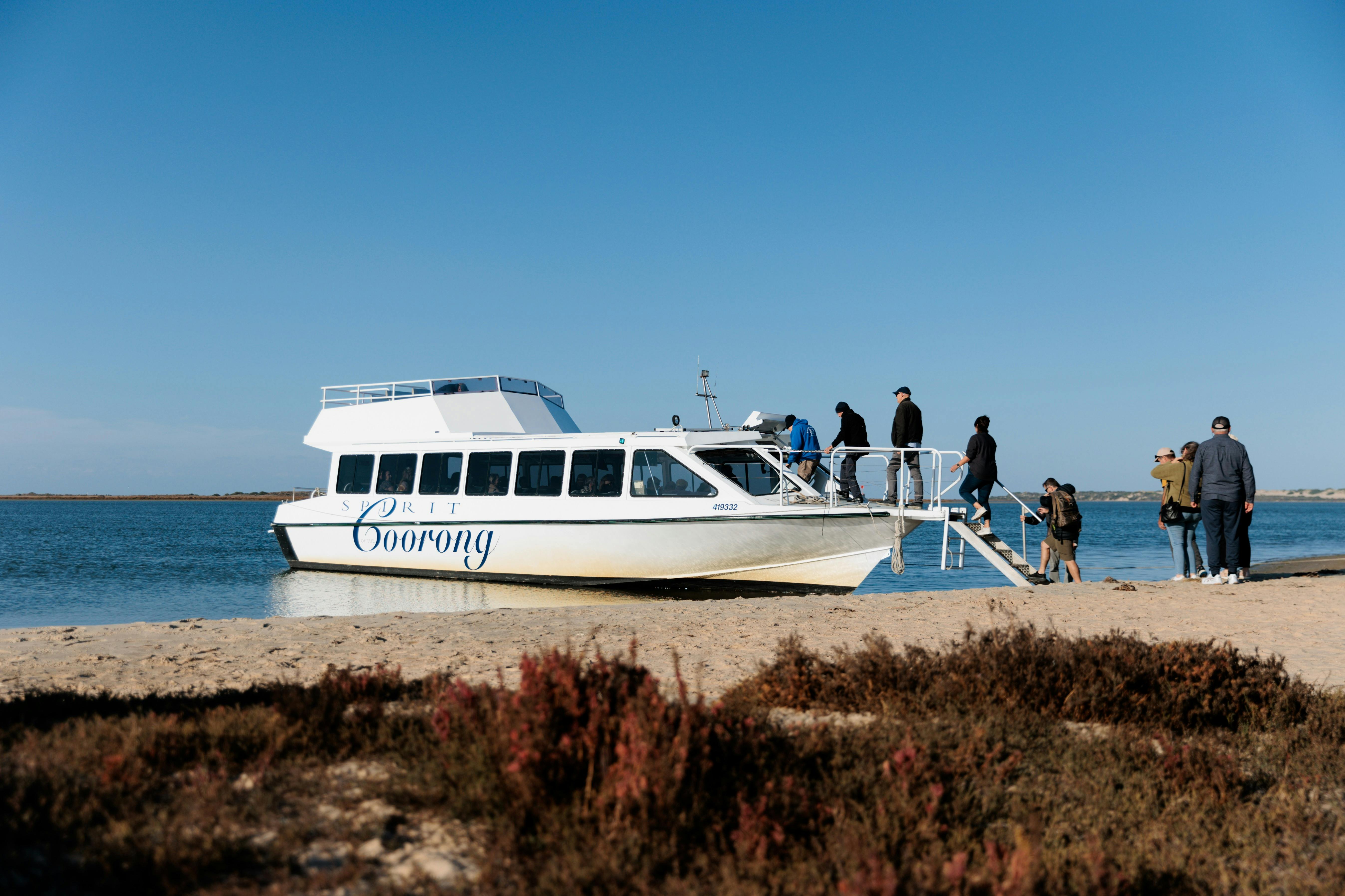 Vessel 'Spirit of the Coorong' beached in the Coorong as guest disembark at the bow of the vessel