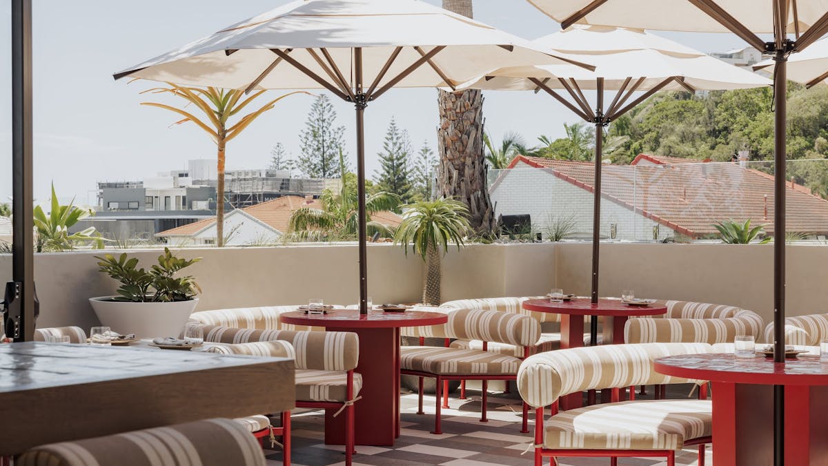 Sueno rooftop showing booths with open umbrellas