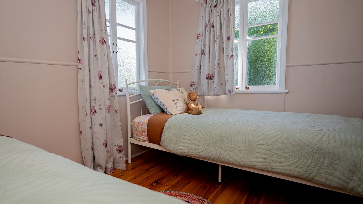 Second bedroom has two kind size single beds