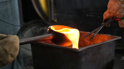 Molten glass poured for sand casting at Canberra Glassworks