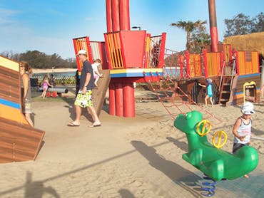 Children playing on gym equipment at the Palm Beach parklands Children playing on gym equipment at the Palm Beach parklands