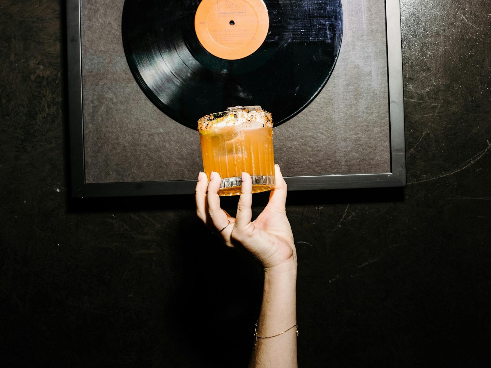 Hand holding up cocktail