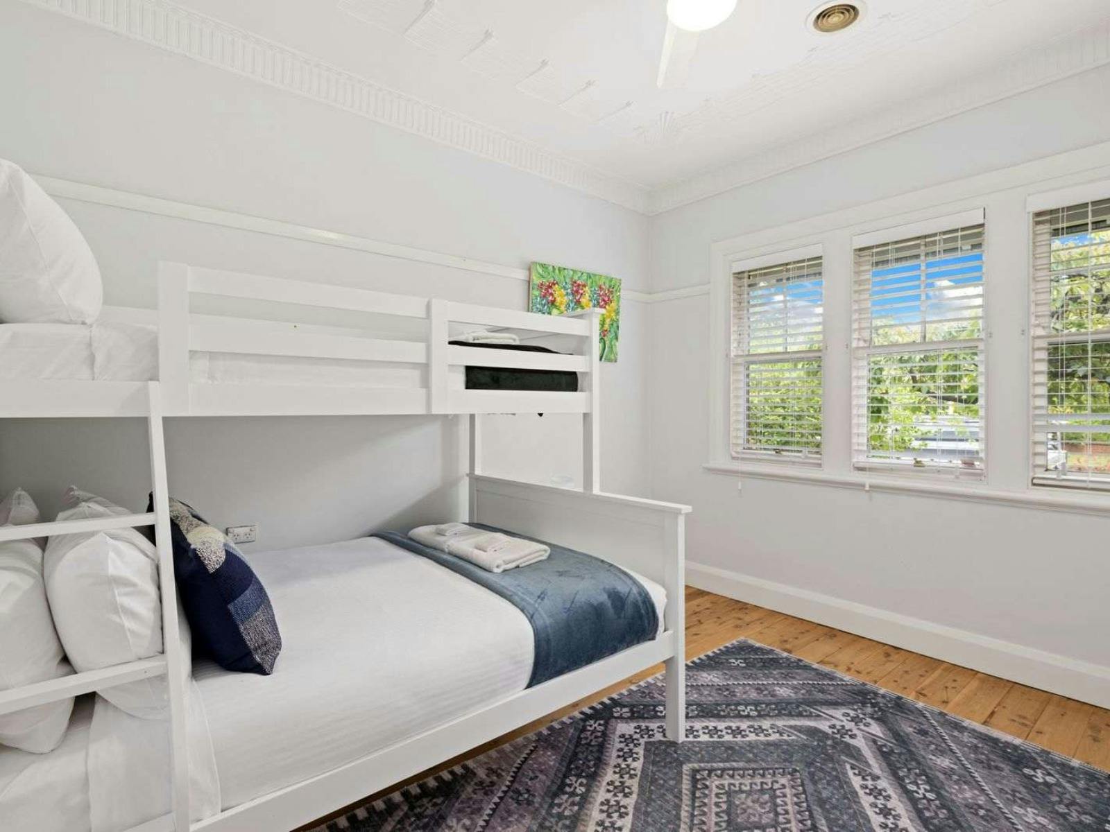 Bedroom with bunk bed with double and single bed