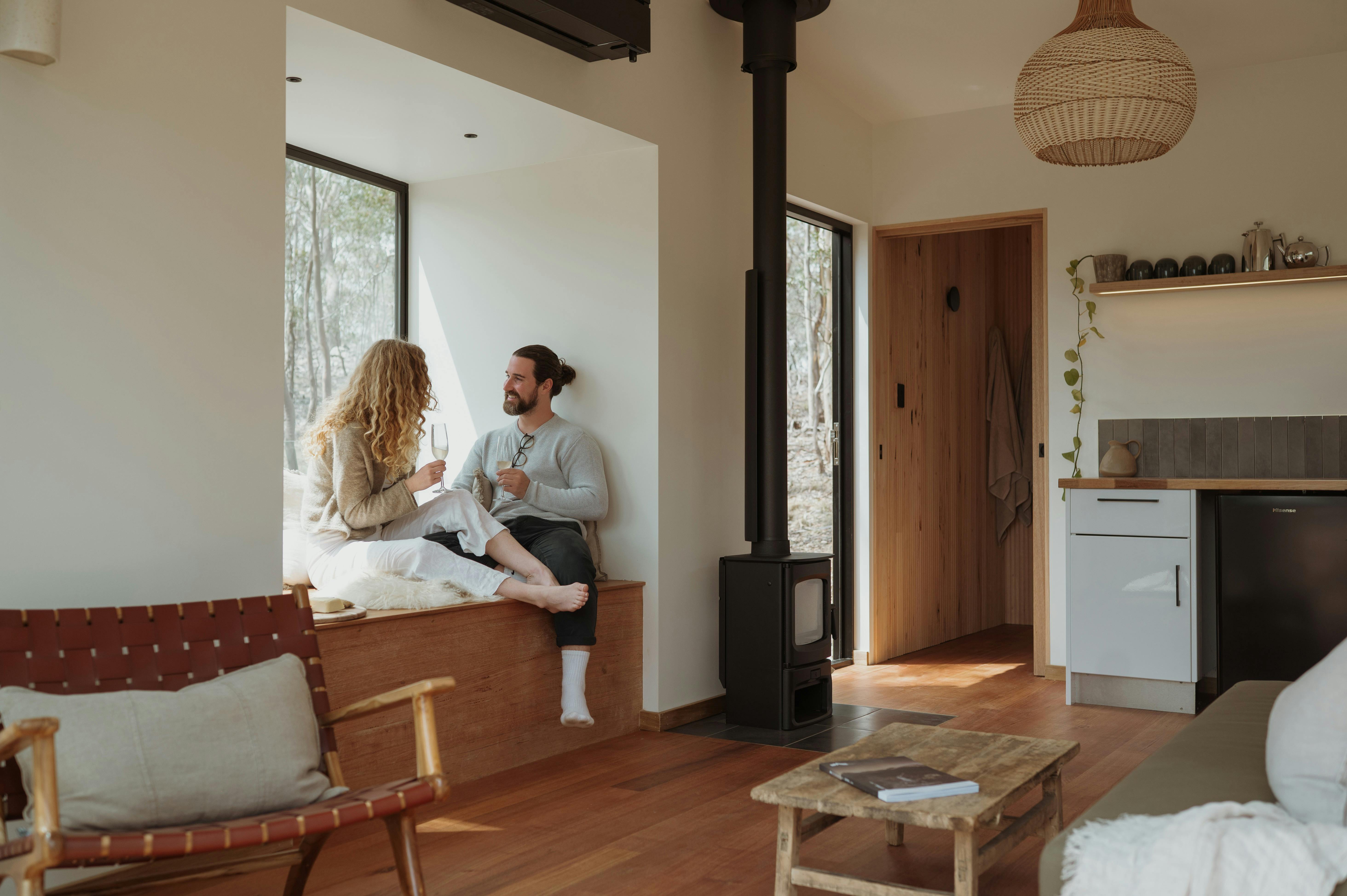 Couple sitting in a beautifully designed cabin