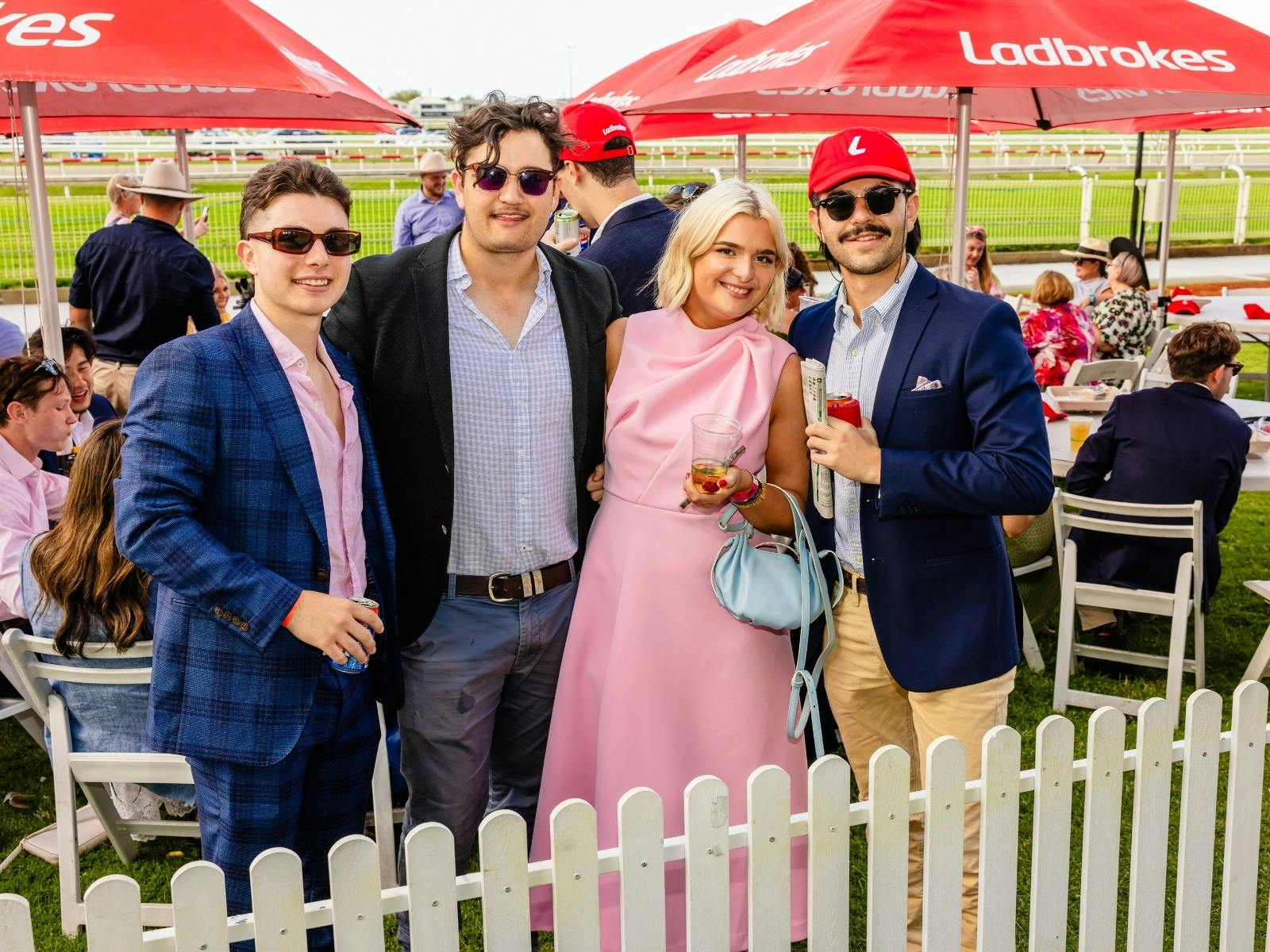 Racegoers celebrate the Keith Noud Stakes Day trackside at Doomben