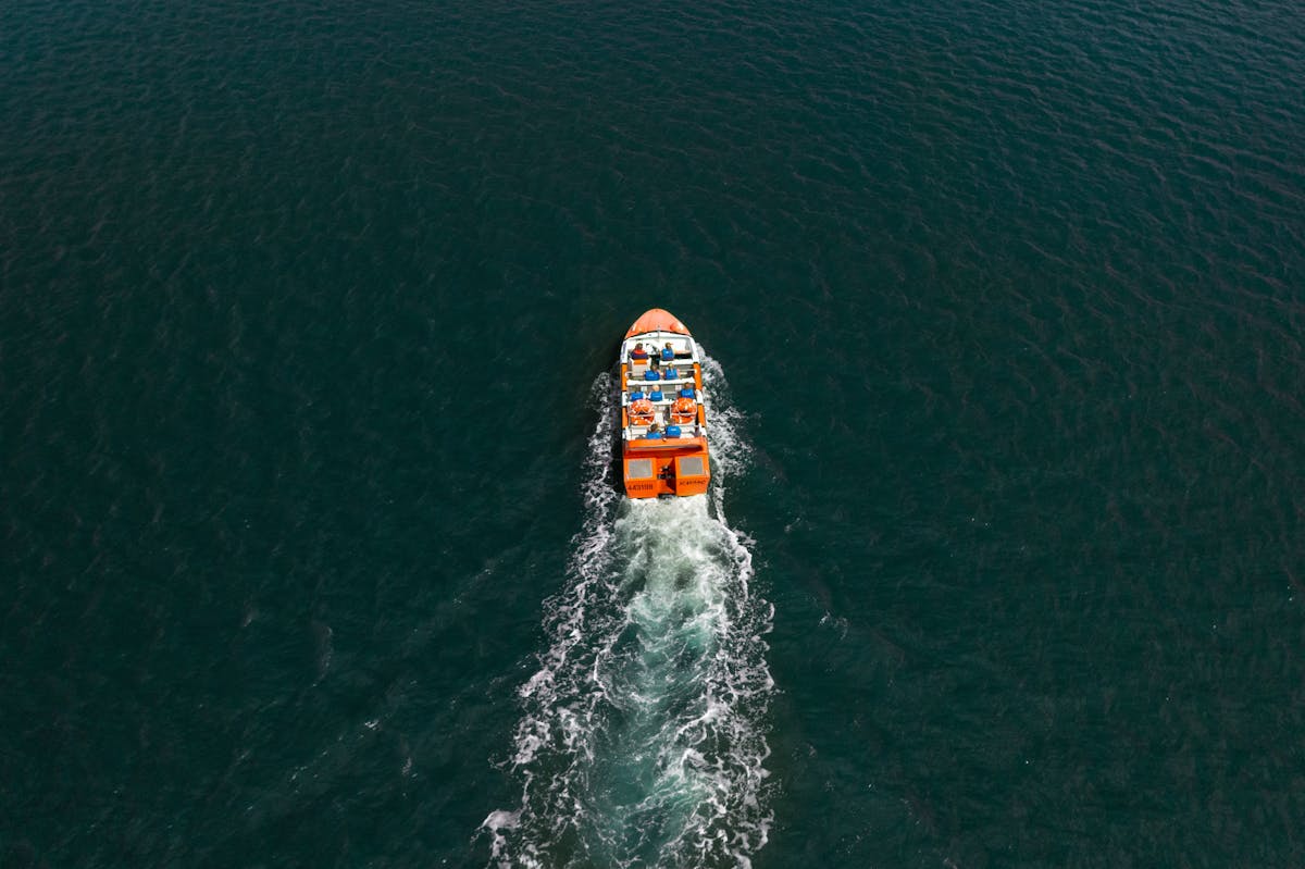 Aerial Shot of the Bad Fishy jet boat driving out of the marina toward the Trinity Inlet in Cairns