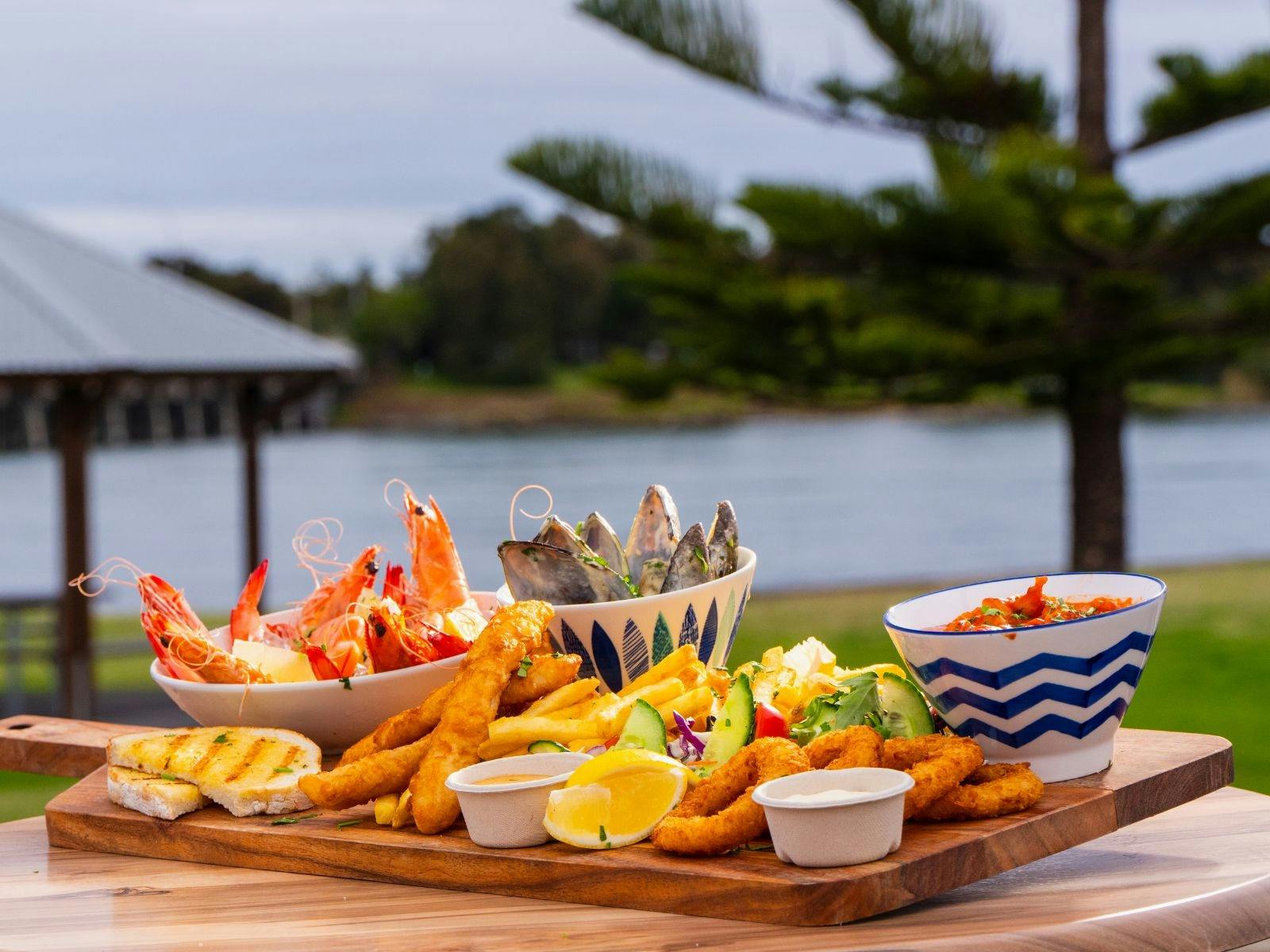 Enjoy a seafood platter here at Club Windang with the view of the lake!
