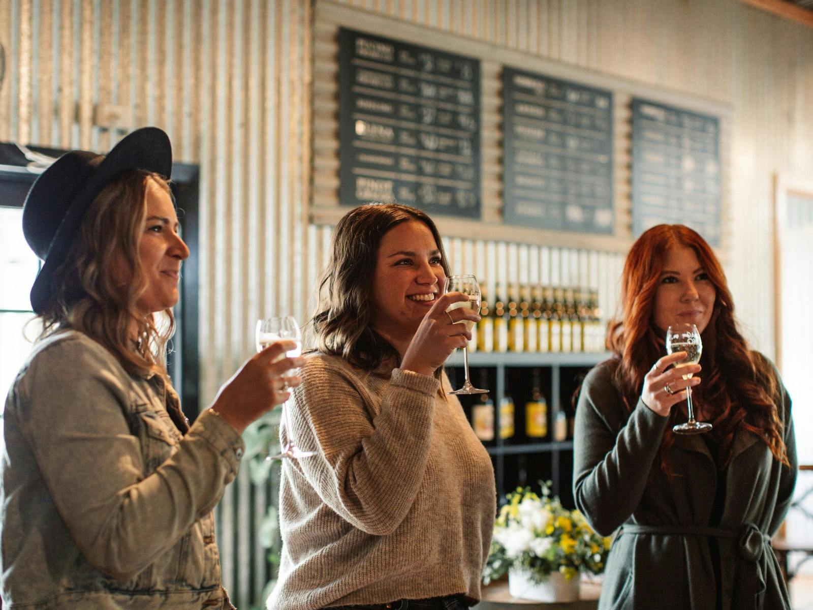Dal Zotto Wines three girls drink prosecco in the trattoria