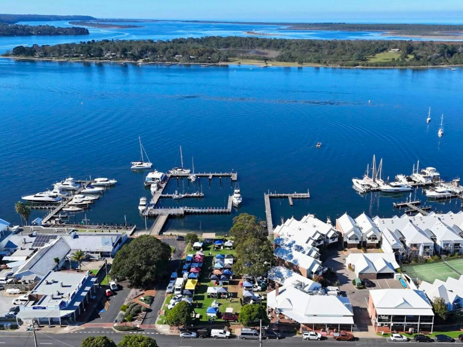 Aerial view looking down at the Metung Market in the village with Bancroft Bay and boats