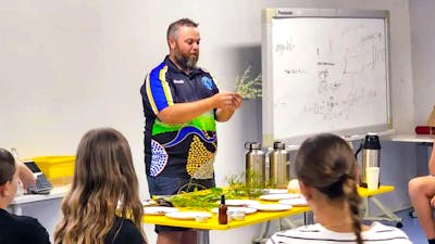 Wiradjuri man Adam Shipp presents to a classroom style audience