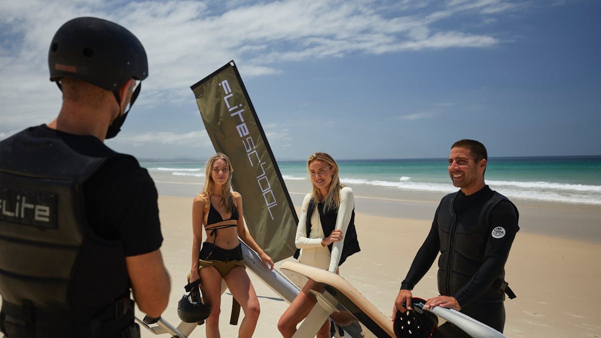 Students and instructor for foiling lessons with Fliteschool Noosa. Beach Setting, Queensland