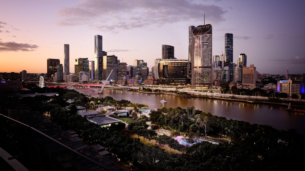 Dusk view of Brisbane’s skyline overlooking the river and South Bank parklands