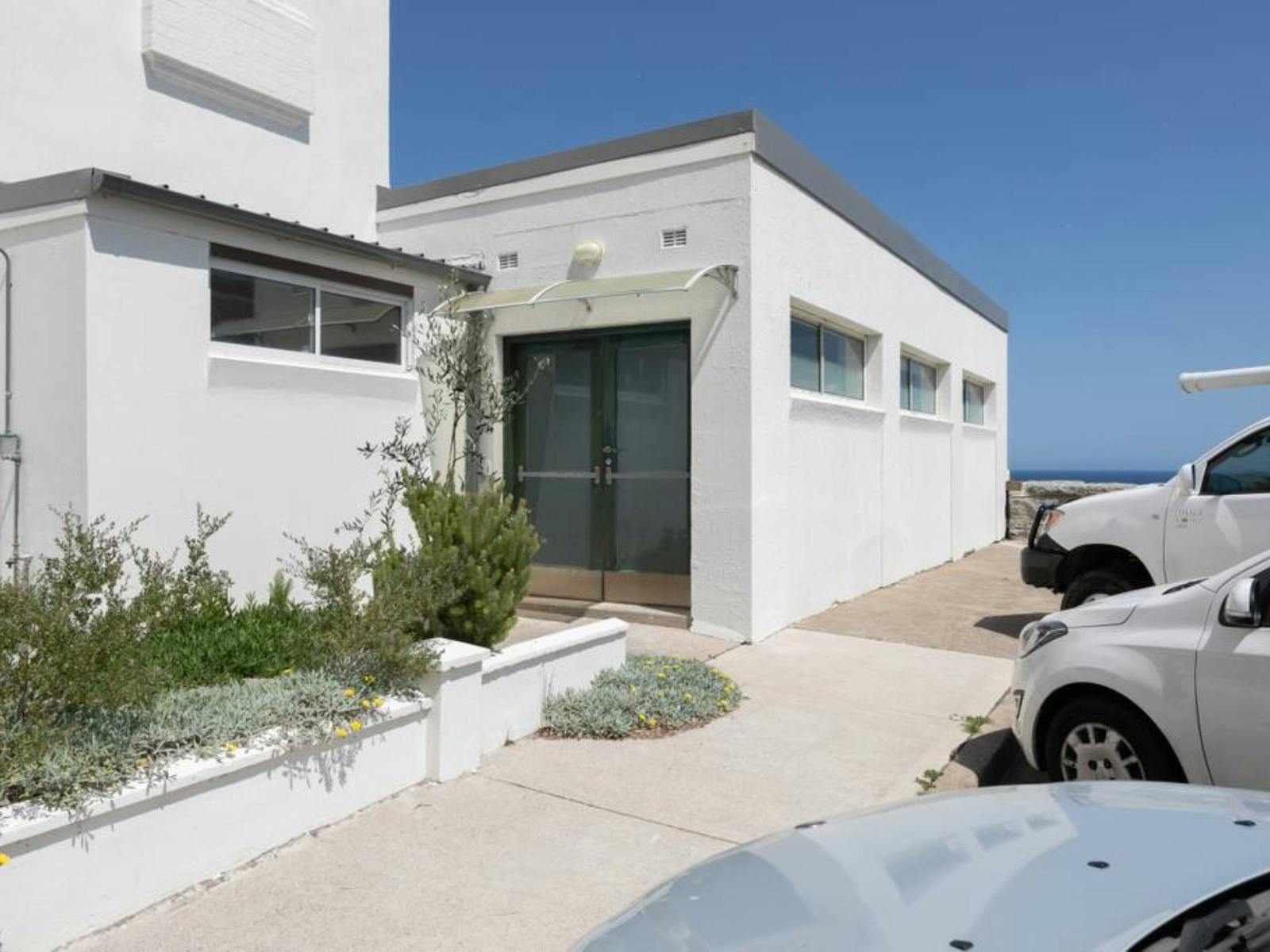 Cliffside apartment with breathtaking views of the ocean and rocky coastline.