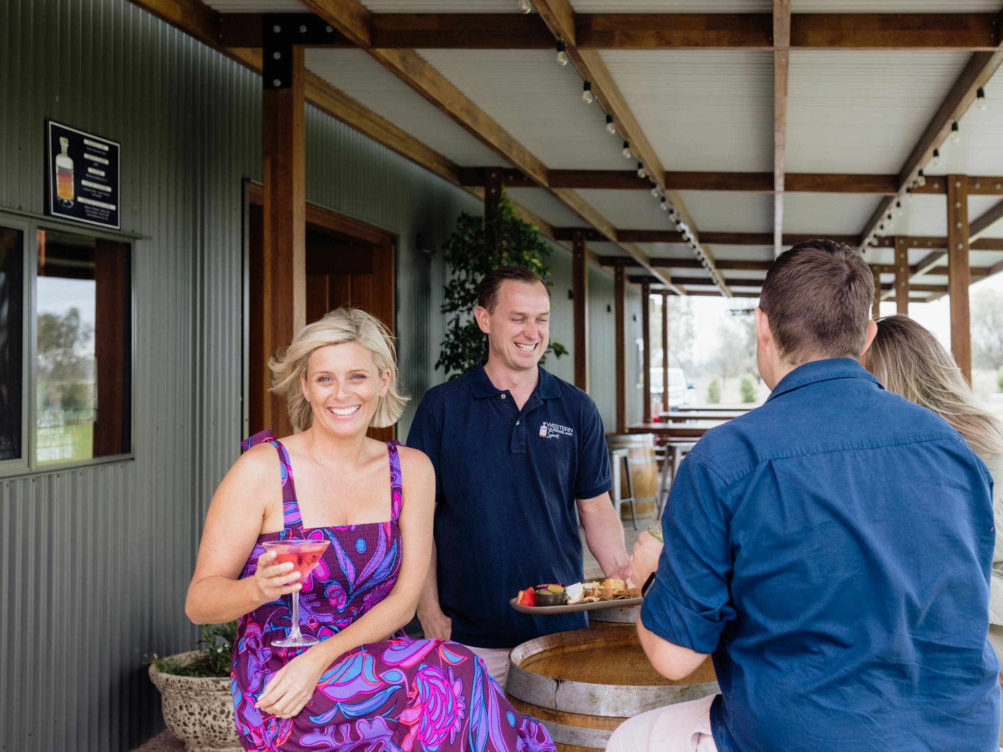 Guests enjoy cocktail on verandah Guests enjoy cocktail on verandah