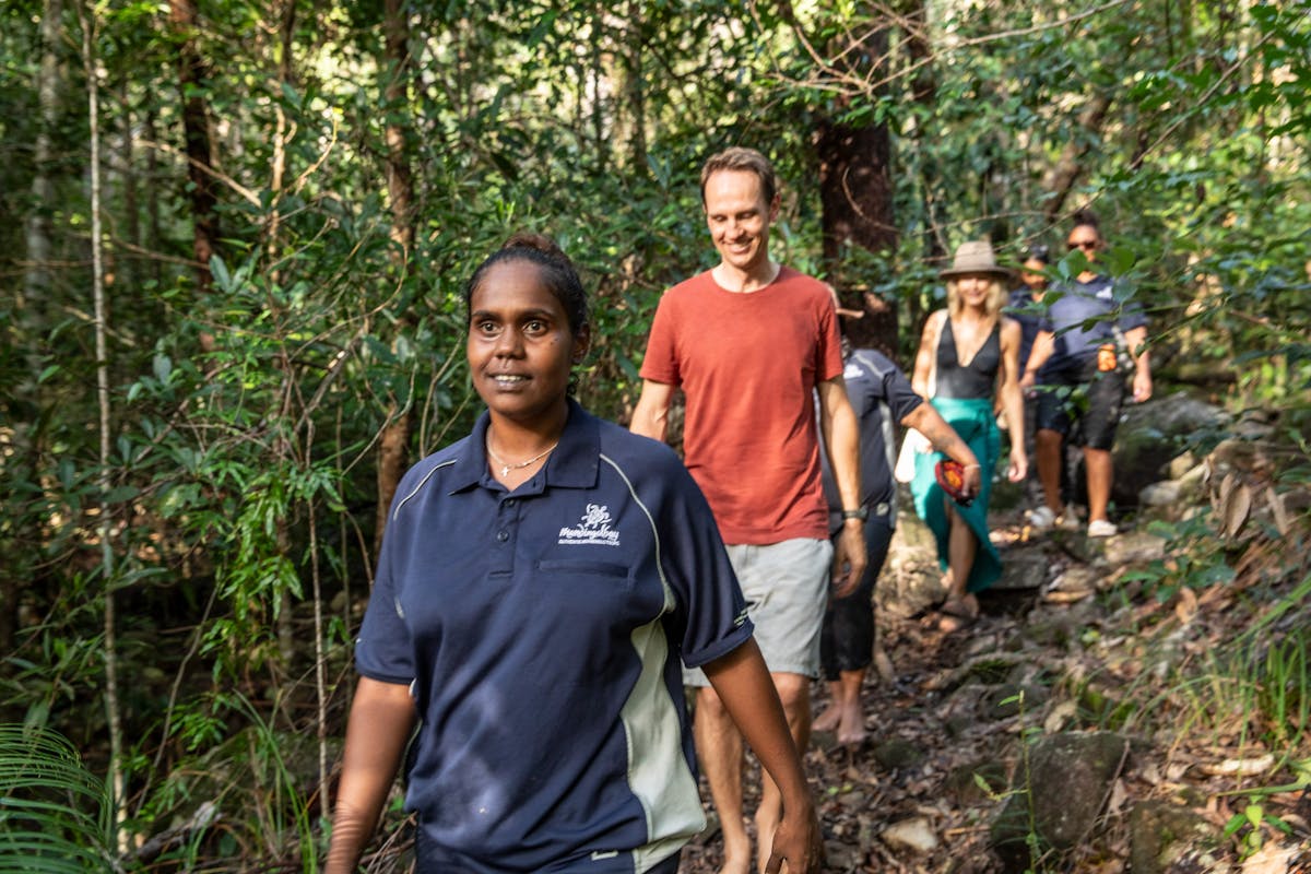 Guides walking through country on tour