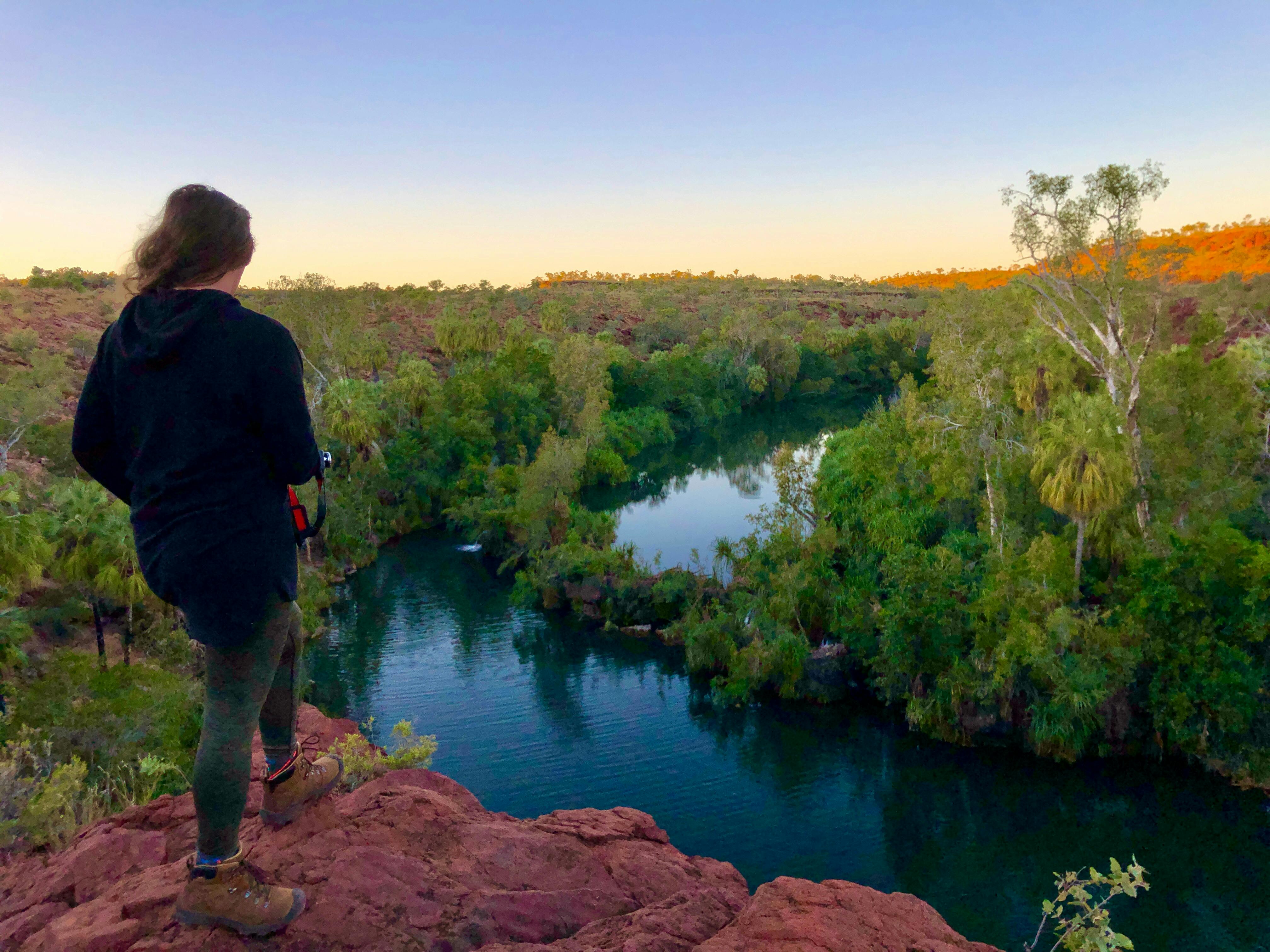 lady looking at waterfalls from viewpoint