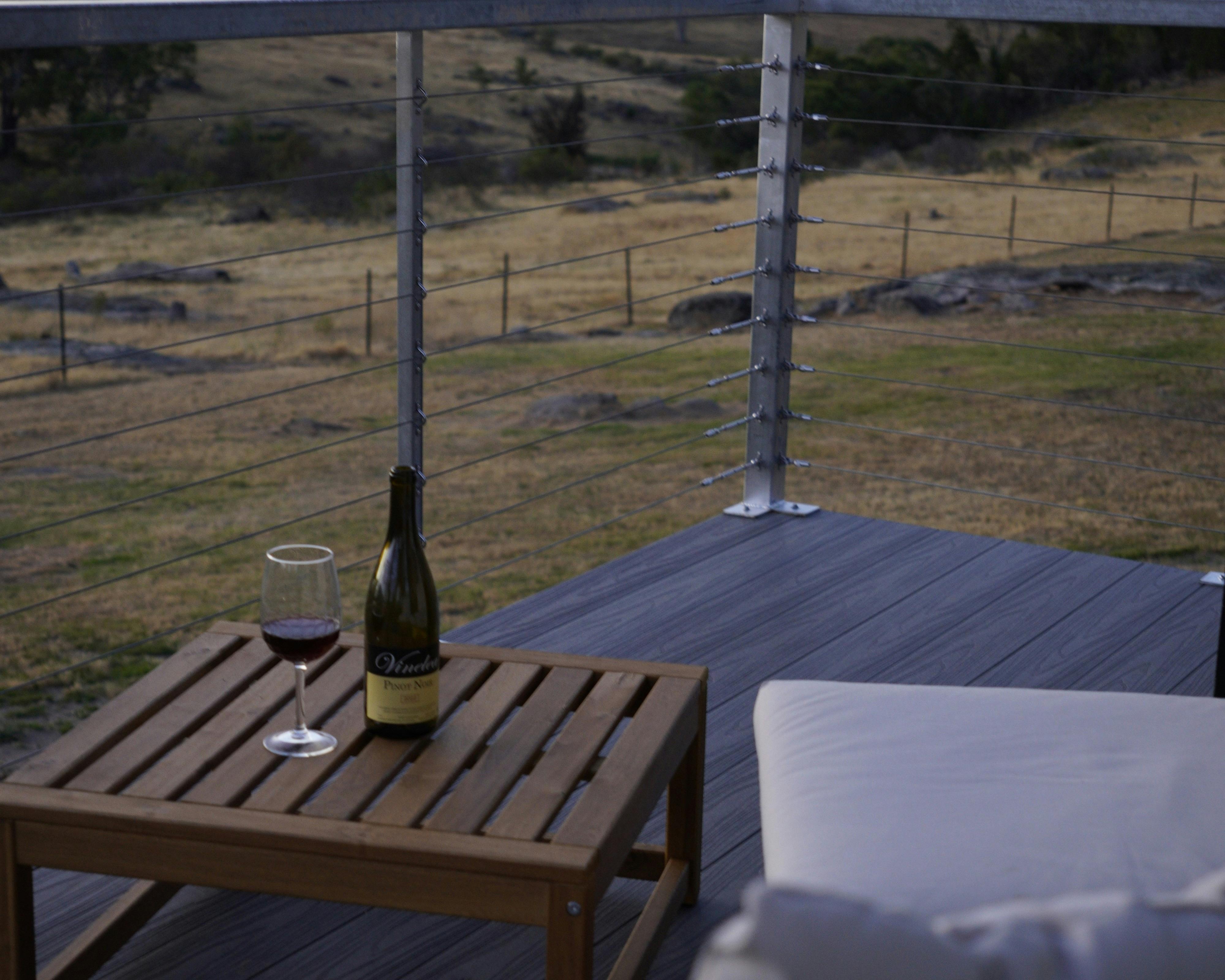 Wide view of surrounding countryside and natural vegetation.