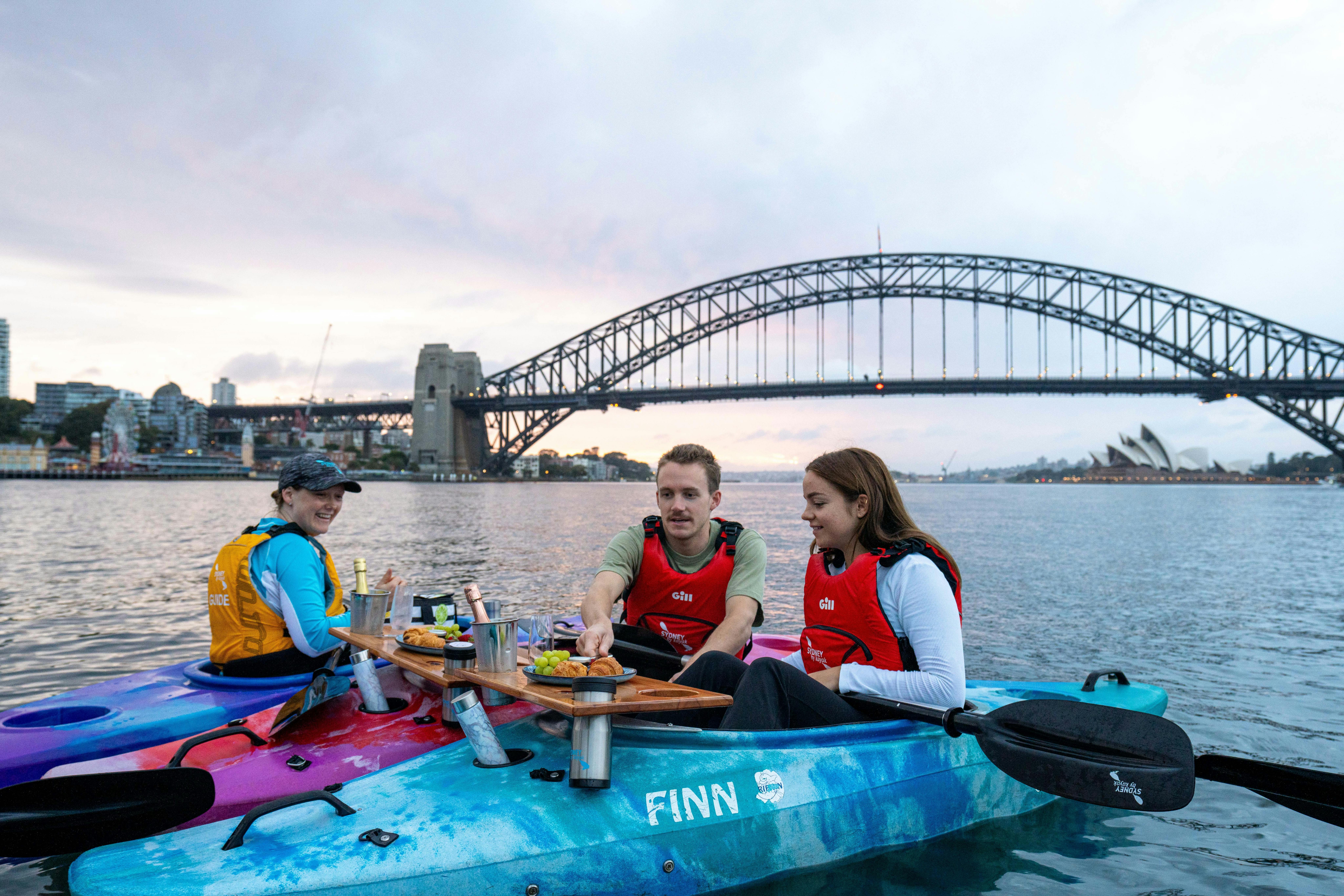Couple get served floating, premium champagne breakfast by their private guide from Sydney By Kayak