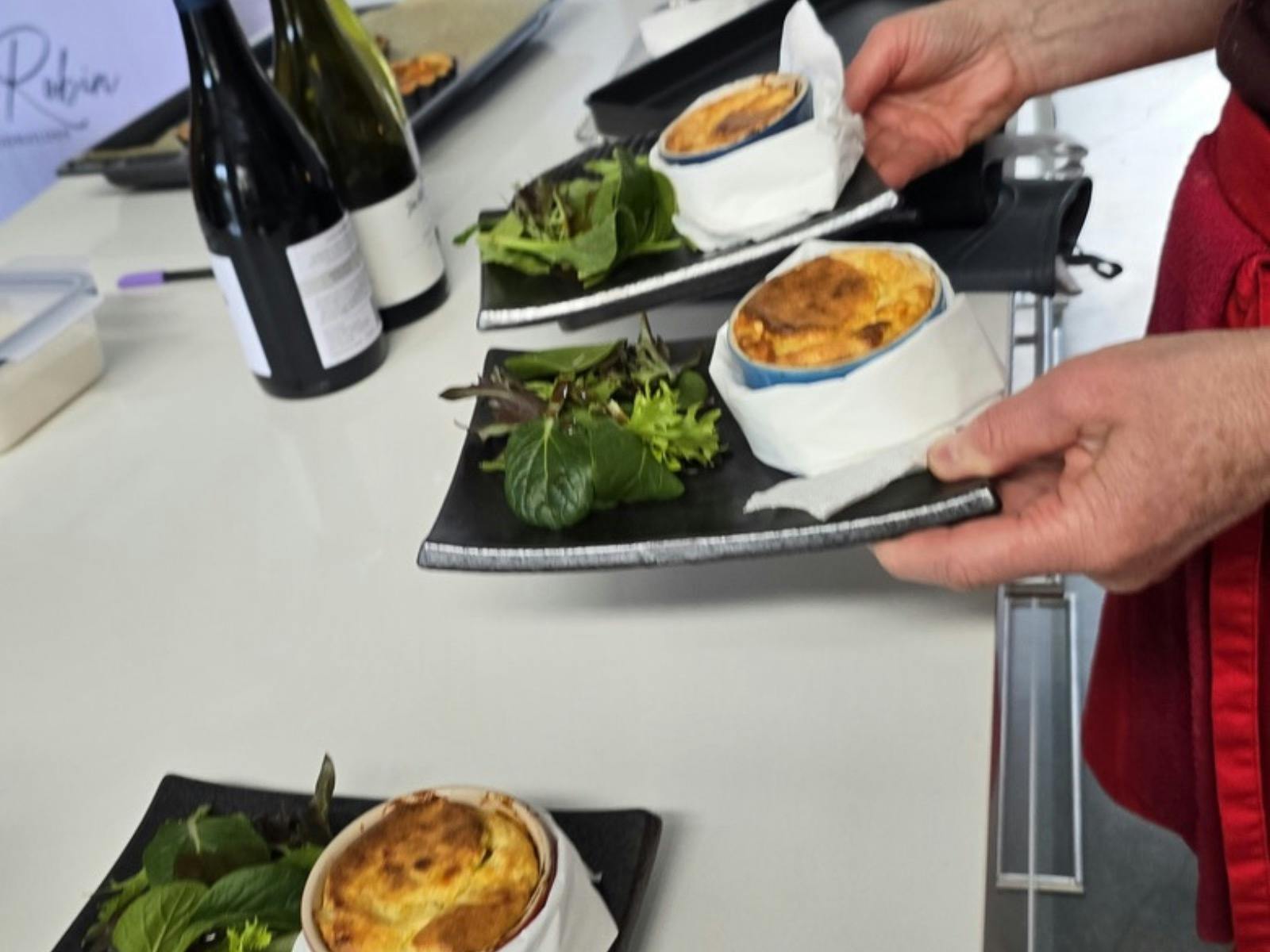 Guest plating a colourful vegetarian dish during Anita Robin’s cooking class