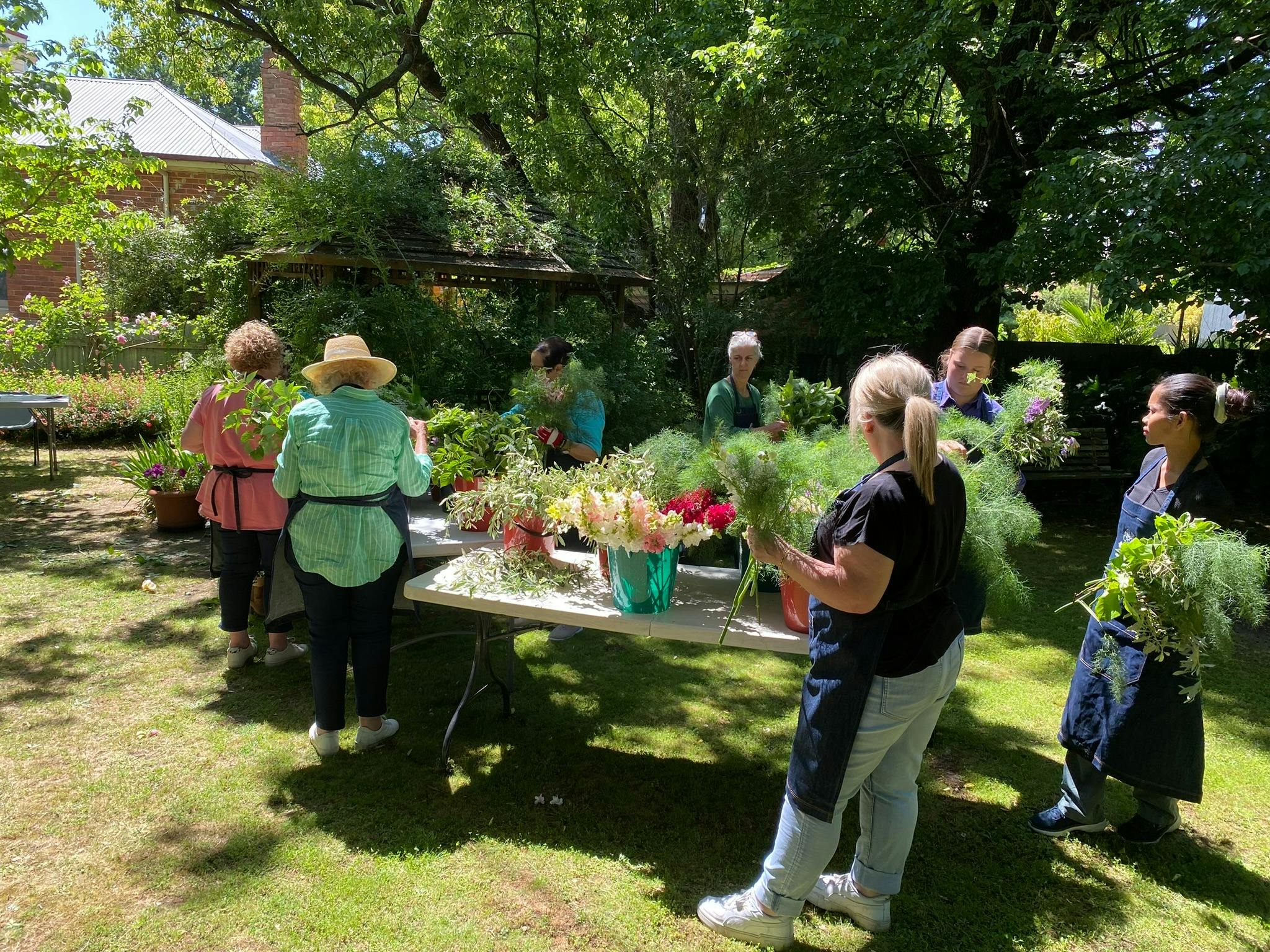 use seasonal flowers and foliages locally grown by Indigo Rose Farm