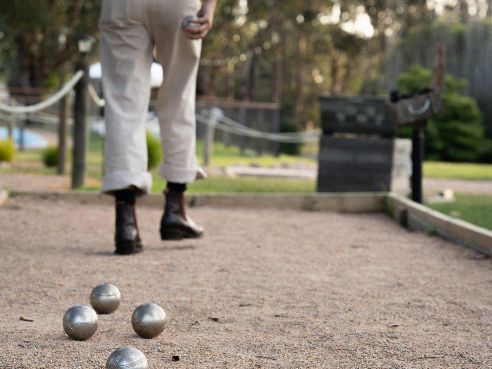 Eight Acres games garden with bocce court, outdoor lawn games and relaxed farm-style setting