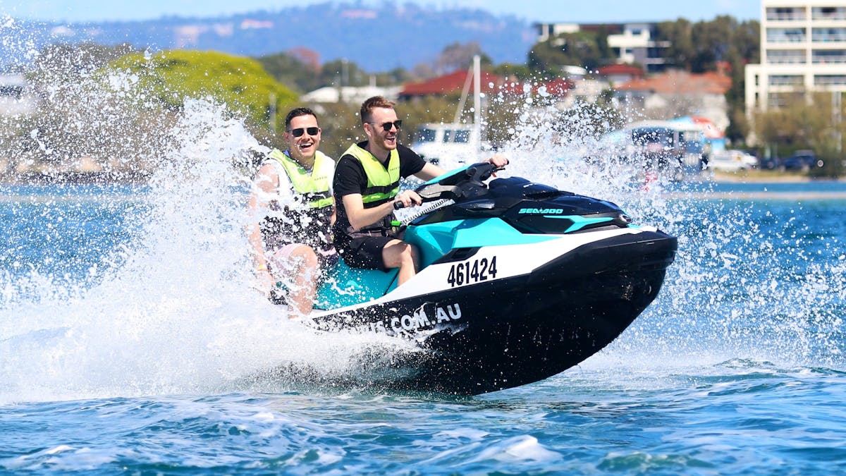 Two men having fun on a jet ski