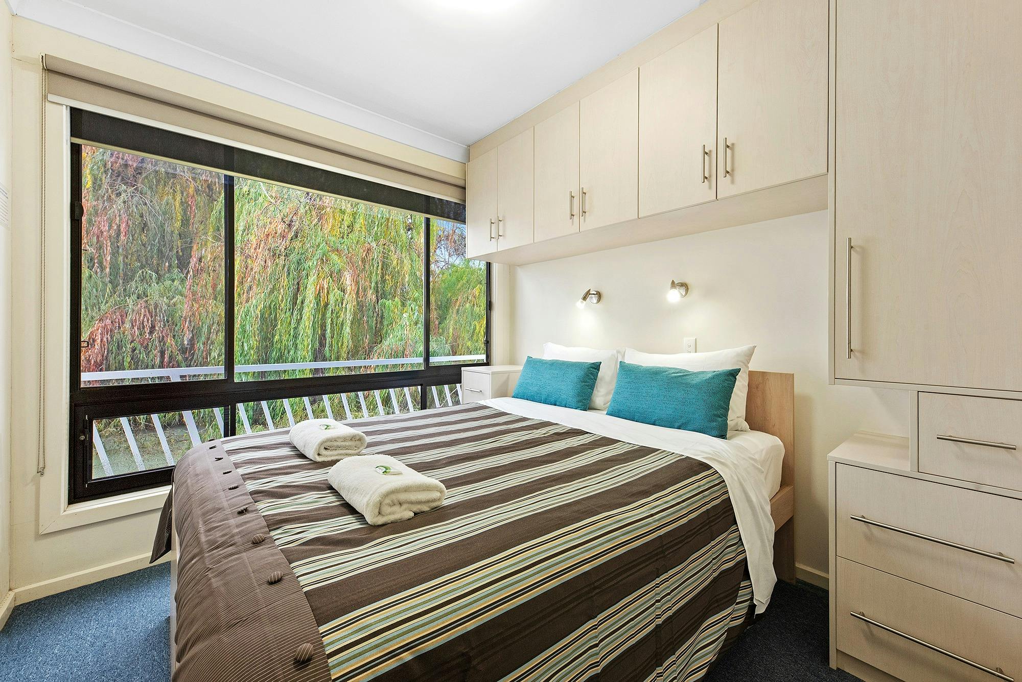 One of the three queen bedrooms on Moving Waters