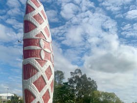 Public artwork of shield in the landscape