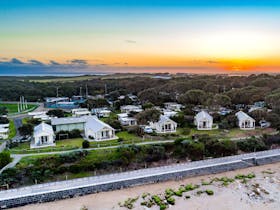 Sunset over our waterfront beach houses at the Barwon Heads Caravan Park