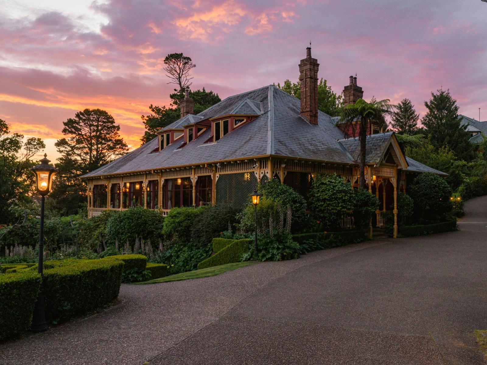 Lilianfels Darley Restaurant and gardens with a sunset backdrop.