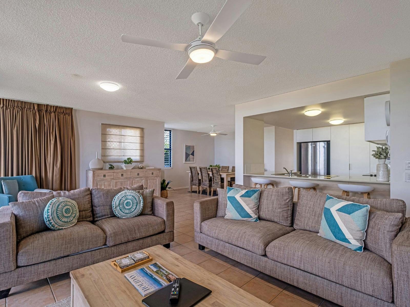 Open plan lounge area with Smart TV and balcony access